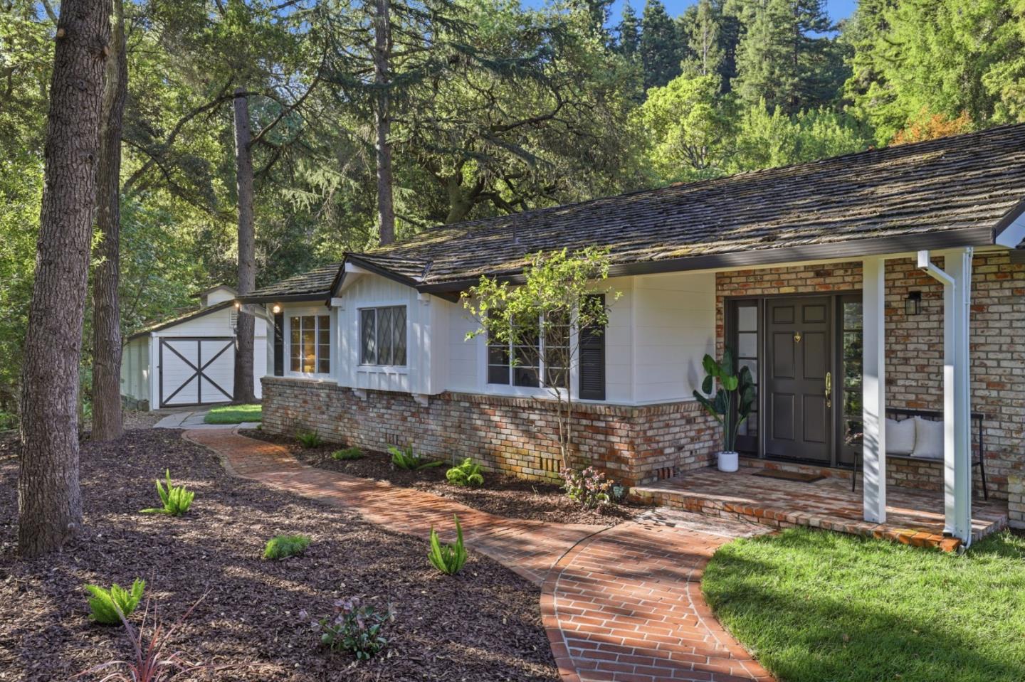 425 Summit Spring Road Woodside, CA 94062 - Photo 4 of 42 a front view of a house with garden