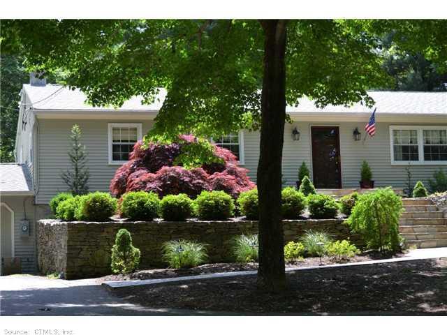 166 Chestnut Hill Road Killingworth, CT 06419 - Photo 1 of 1 a front view of a house with garden