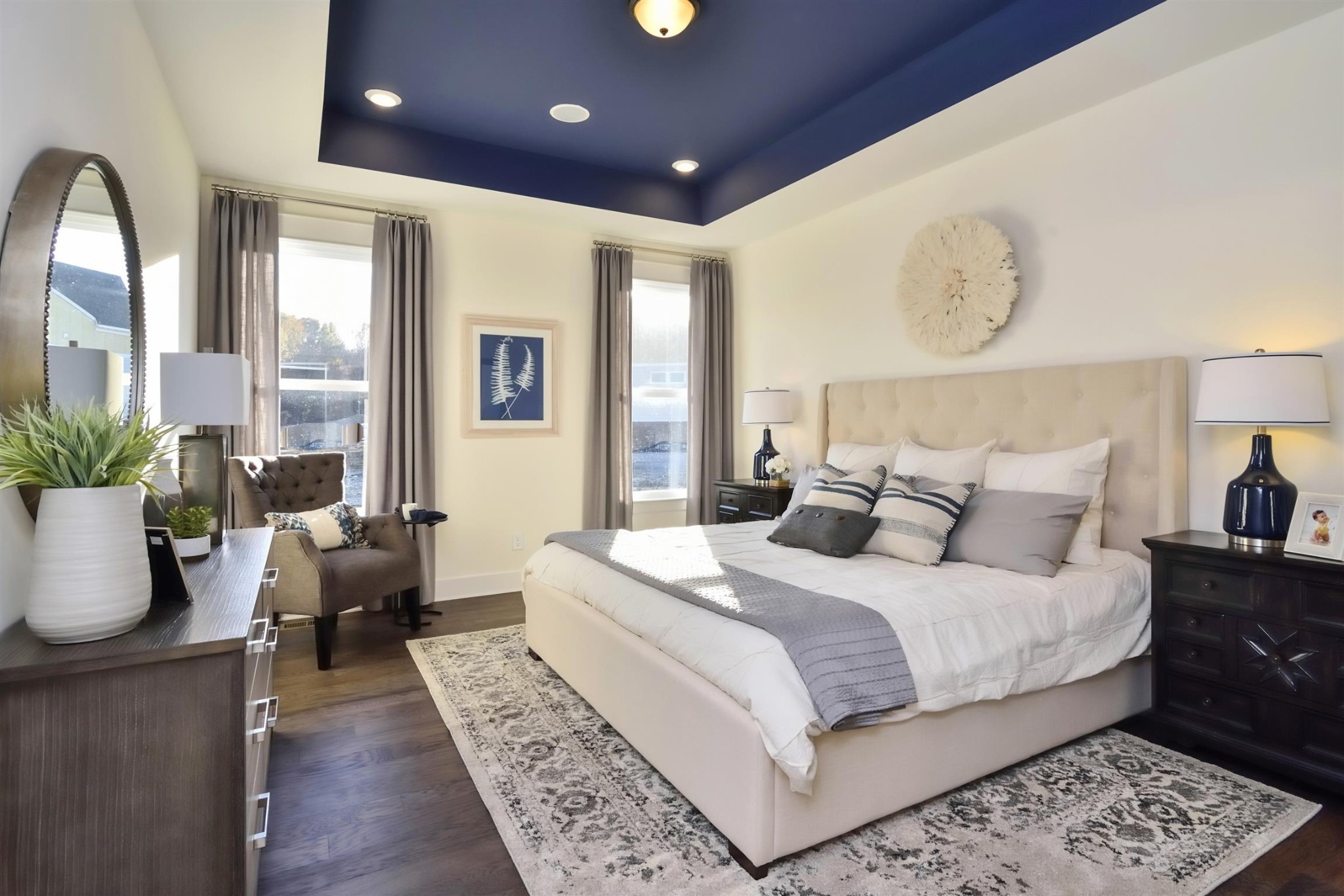 76 Remington Road Lebanon, TN 37090 - Photo 3 of 21 a bedroom with a large bed and wooden floor