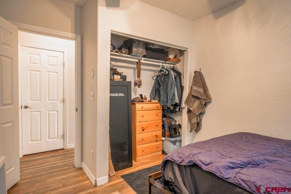 522 East First Street, Unit A & B Trinidad, CO 81082 - Photo 16 of 45 a bedroom with a bed and the view of en suite bathroom
