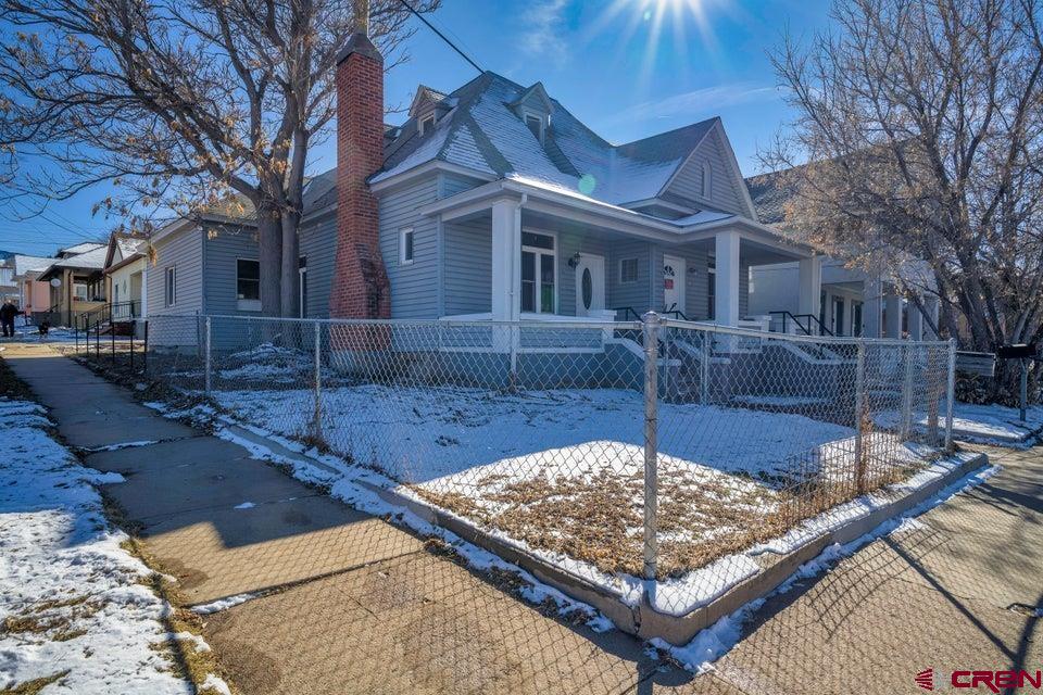 522 East First Street, Unit A & B Trinidad, CO 81082 - Photo 2 of 45 a front view of a house with a yard