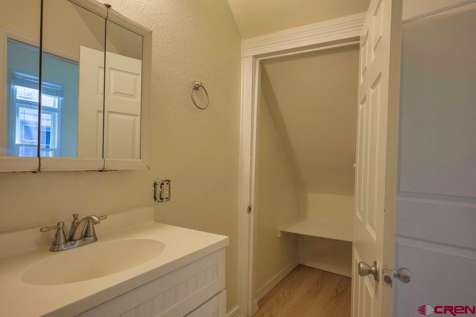 522 East First Street, Unit A & B Trinidad, CO 81082 - Photo 21 of 45 a bathroom with a sink and a mirror
