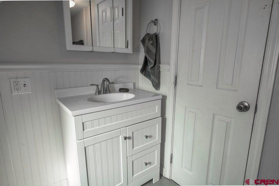 522 East First Street, Unit A & B Trinidad, CO 81082 - Photo 27 of 45 a bathroom with a sink and a mirror