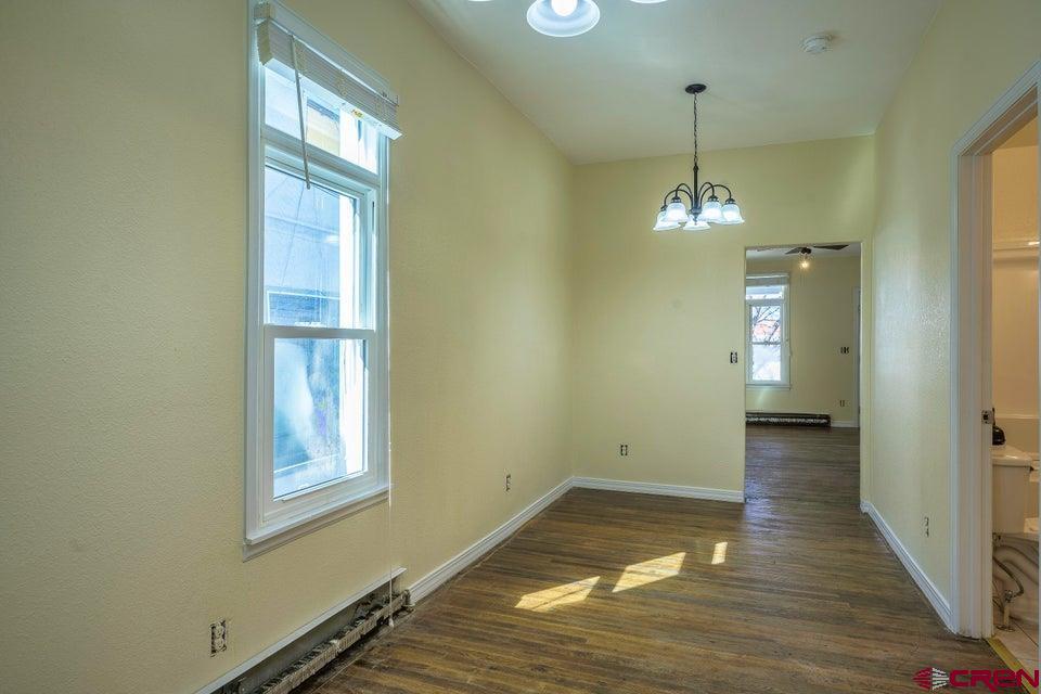 522 East First Street, Unit A & B Trinidad, CO 81082 - Photo 33 of 45 a view of empty room with wooden floor and fan