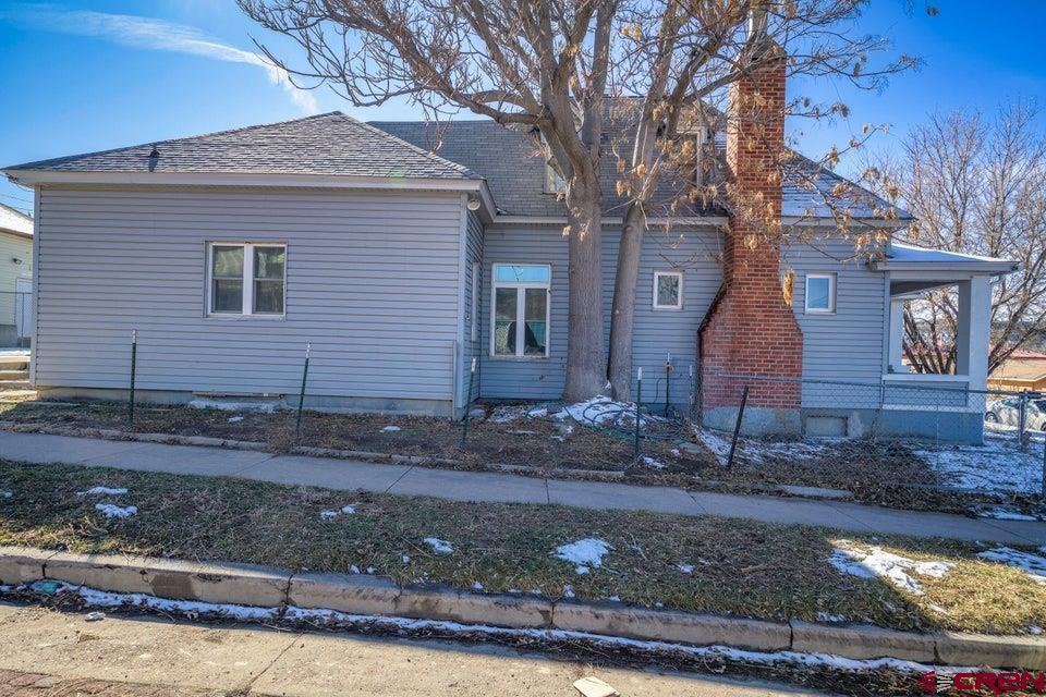 522 East First Street, Unit A & B Trinidad, CO 81082 - Photo 39 of 45 a front view of a house with garden