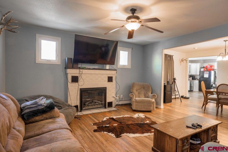 522 East First Street, Unit A & B Trinidad, CO 81082 - Photo 4 of 45 a living room with furniture a flat screen tv and a fireplace
