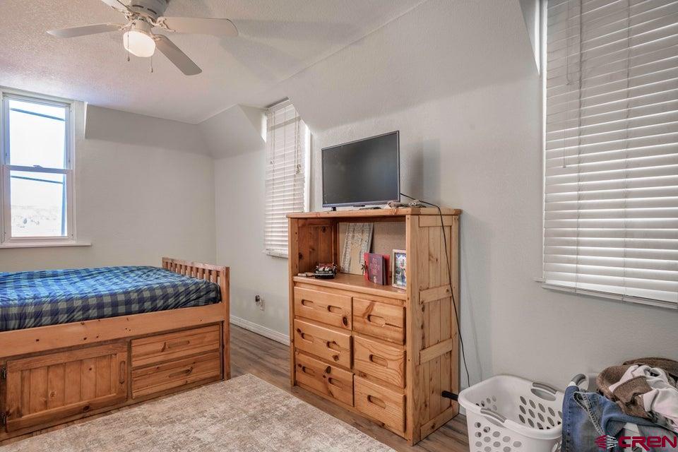 522 East First Street, Unit A & B Trinidad, CO 81082 - Photo 6 of 45 a room with furniture and flat screen tv
