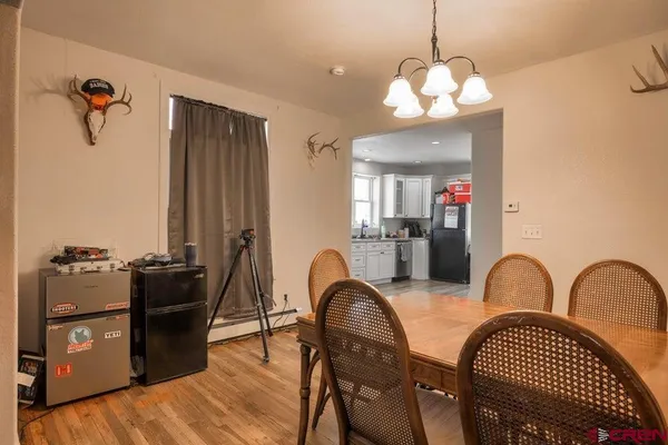 a view of hallway with wooden floor