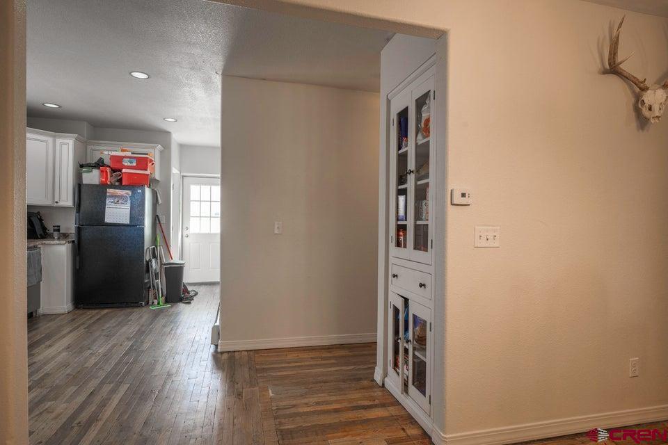 522 East First Street, Unit A & B Trinidad, CO 81082 - Photo 9 of 45 a view of hallway with wooden floor