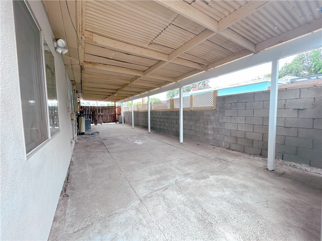 1807 Berkeley Avenue Pomona, CA 91768 - Photo 8 of 8 a view of empty room with wooden walls