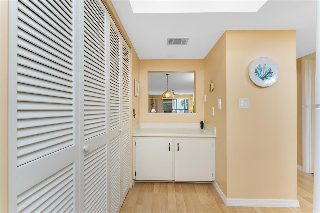2700 North Beach Road, Unit E107 Englewood, FL 34223 - Photo 13 of 62 a view of a hallway to a bedroom