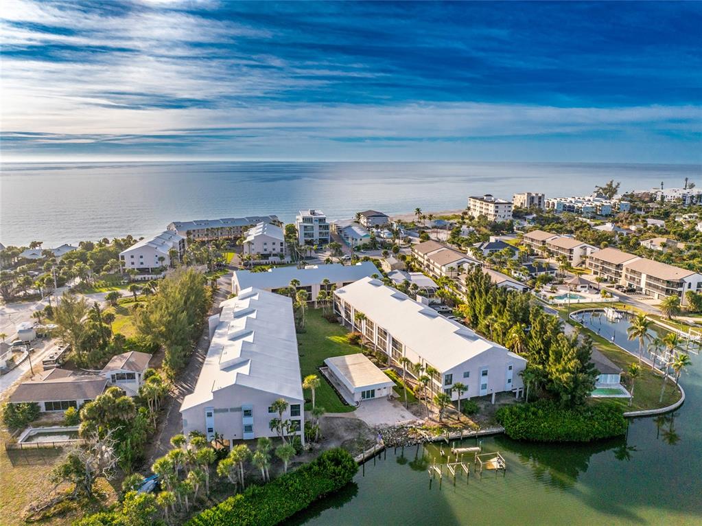 2700 North Beach Road, Unit E107 Englewood, FL 34223 - Photo 57 of 62 an aerial view of residential houses with outdoor space