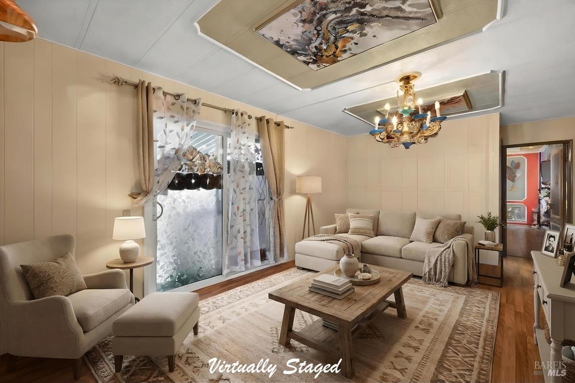 145 Círculo Todos Rohnert Park, CA 94928 - Photo 13 of 39 a living room with furniture and a chandelier