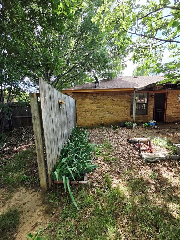 722 South Church Street Pilot Point, TX 76258 - Photo 21 of 37 a backyard of a house with lots of green space