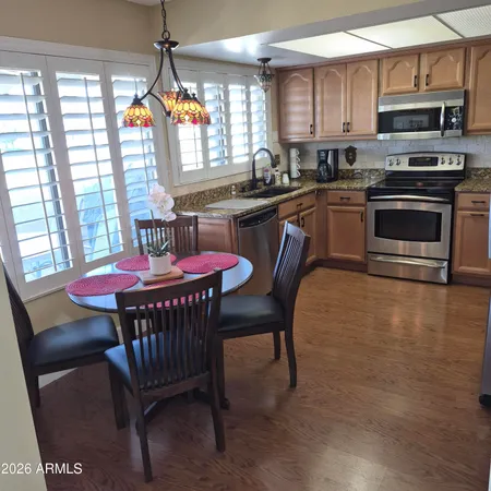 a view of a dining room with furniture window and outside view