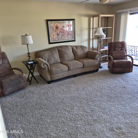 a living room with furniture and a couch