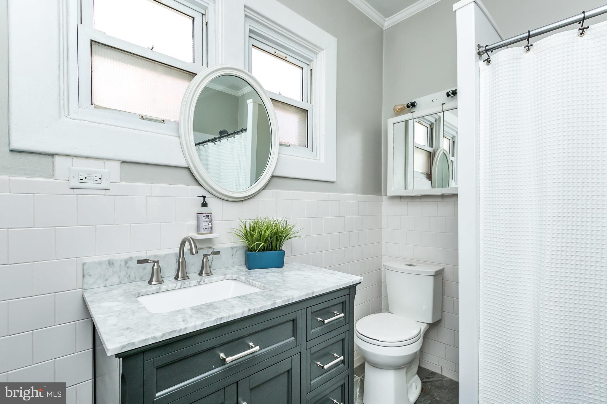 615 Aldershot Road Baltimore, MD 21229 - Photo 22 of 45 Convenient walk-in stall shower