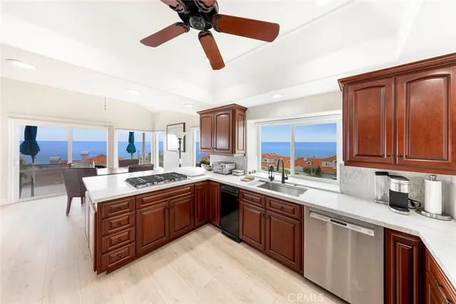 a kitchen with a table chairs refrigerator and microwave