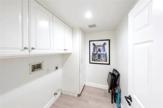 a view of entryway livingroom and hall with wooden floor