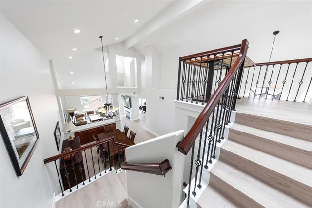 a bedroom with a bed a dresser and a window