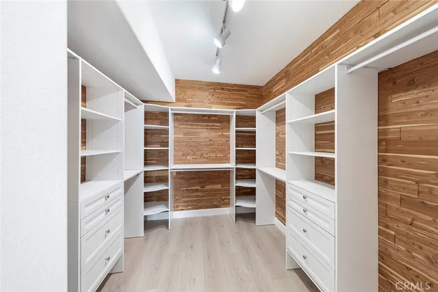 a balcony with furniture and a potted plant