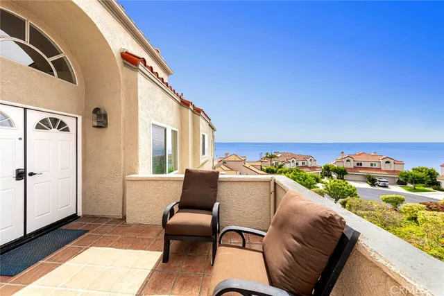 a view of balcony with furniture