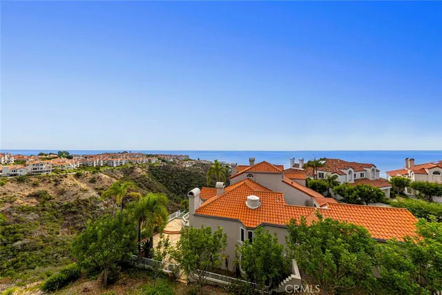 a view of a swimming pool and lounge chairs