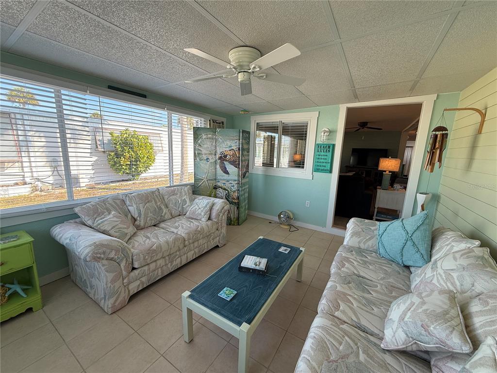 5691 Teahouse Road Venice, FL 34293 - Photo 11 of 31 a living room with furniture and a window