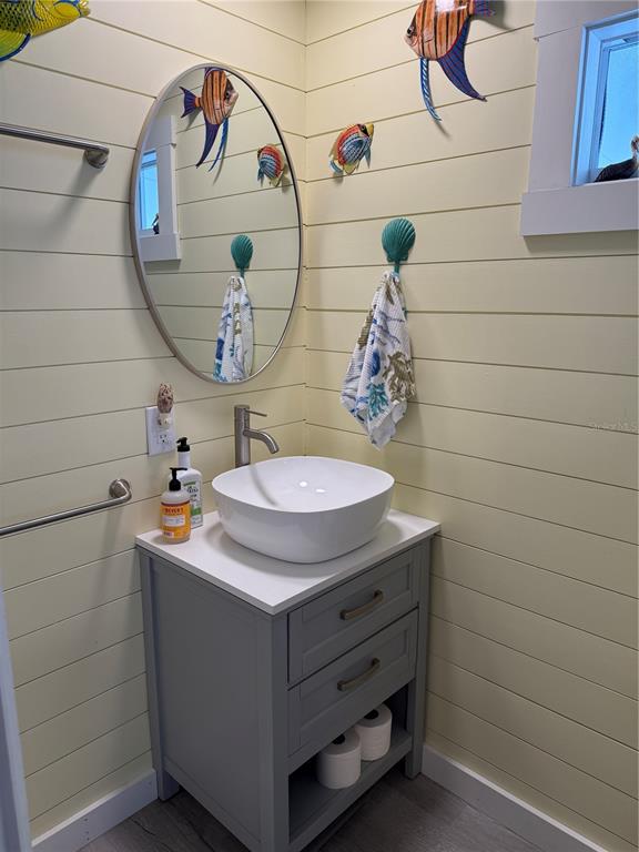 5691 Teahouse Road Venice, FL 34293 - Photo 14 of 31 a bathroom with a sink and a mirror