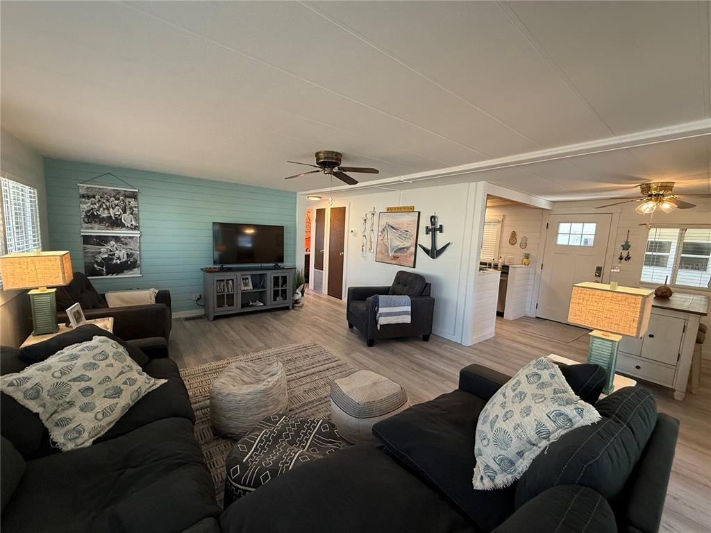 5691 Teahouse Road Venice, FL 34293 - Photo 2 of 31 a living room with furniture and a flat screen tv