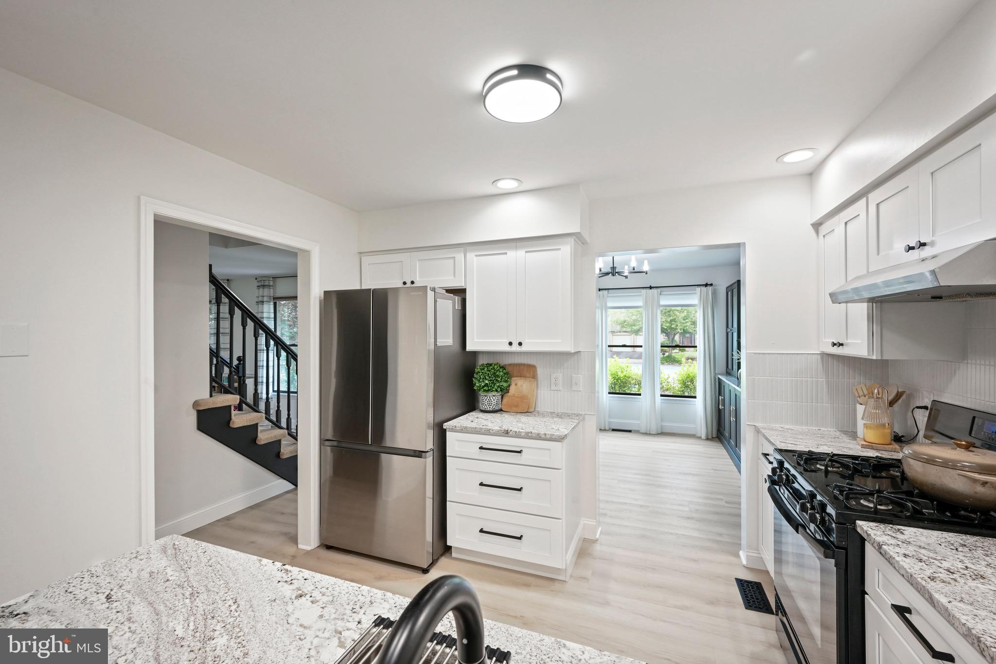 329 Hunter Path Road Hummelstown, PA 17036 - Photo 11 of 37 a kitchen with a refrigerator and a stove