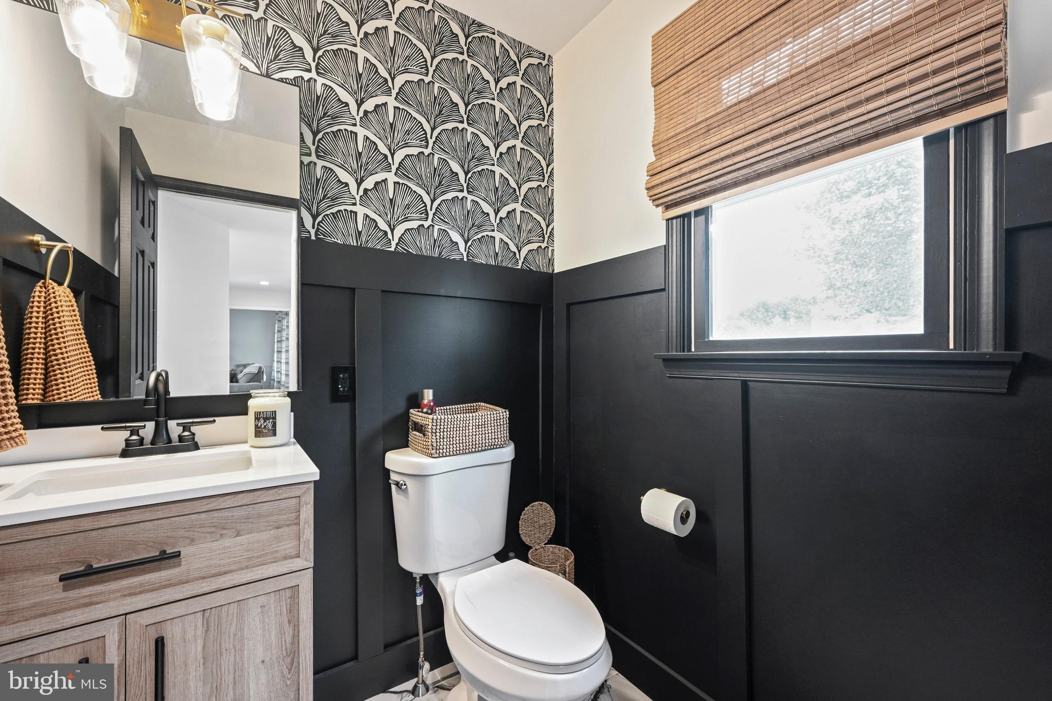 329 Hunter Path Road Hummelstown, PA 17036 - Photo 12 of 37 a bathroom with a toilet a sink a mirror a window and vanity