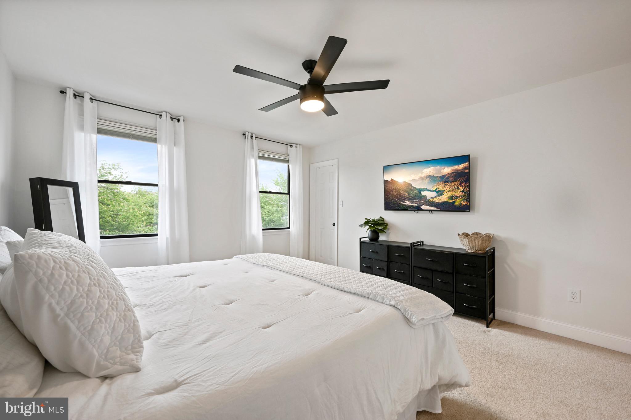 329 Hunter Path Road Hummelstown, PA 17036 - Photo 13 of 37 a bedroom with a bed and a chandelier