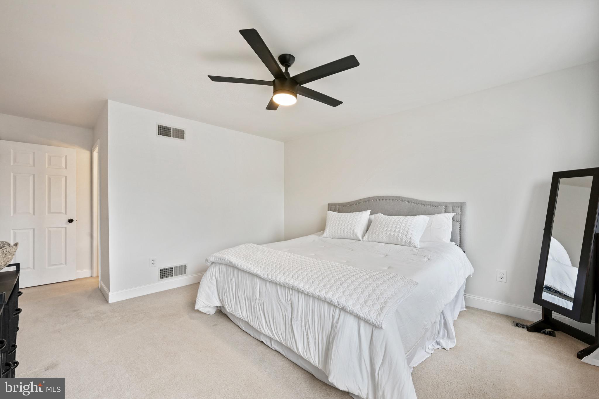 329 Hunter Path Road Hummelstown, PA 17036 - Photo 14 of 37 a bedroom with a bed and a ceiling fan