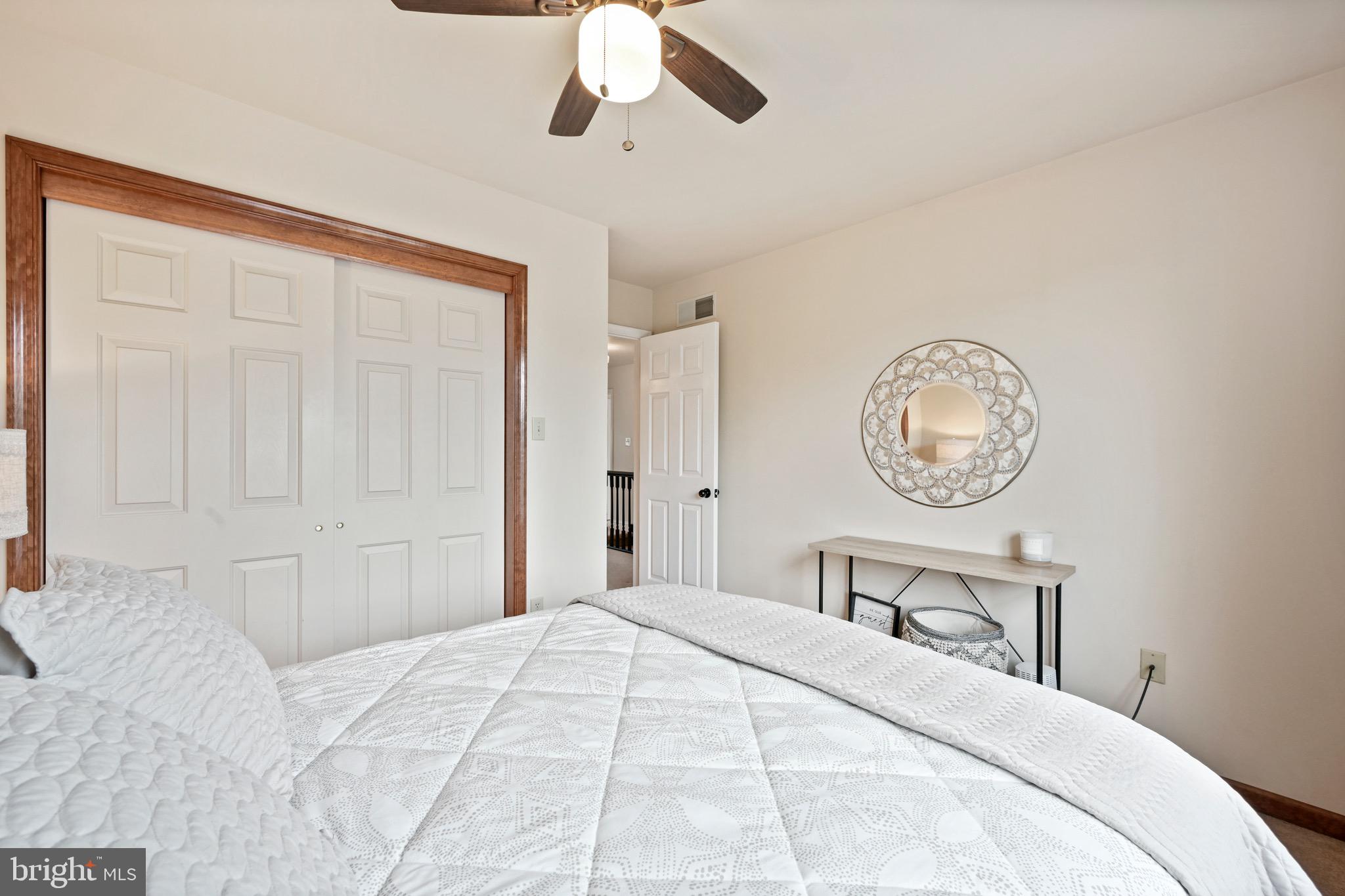 329 Hunter Path Road Hummelstown, PA 17036 - Photo 20 of 37 a bedroom with a bed and a chandelier