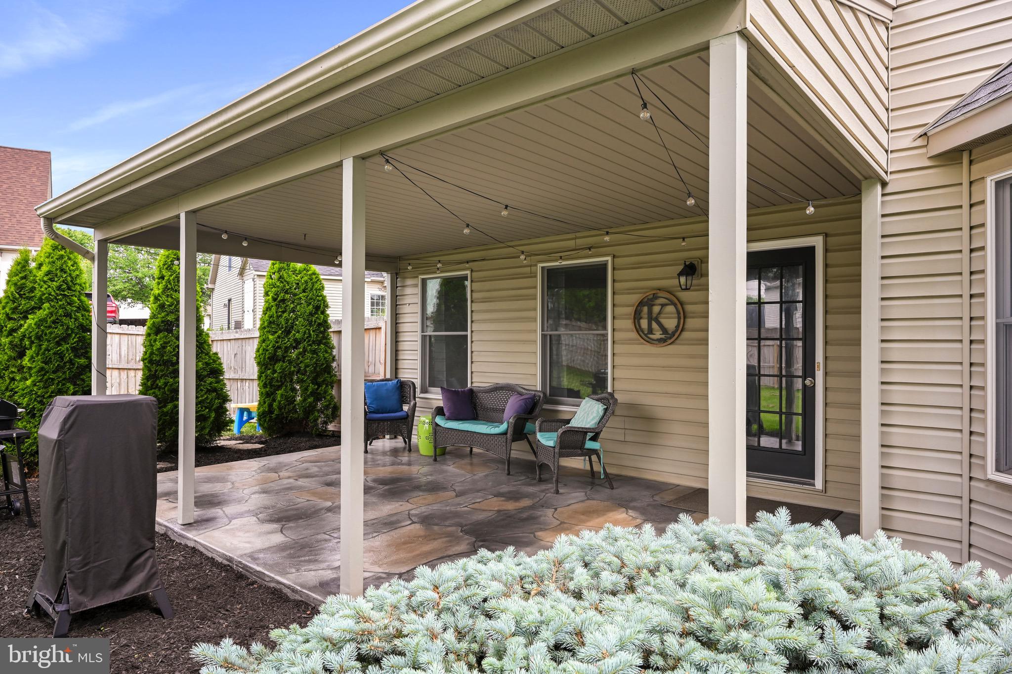 329 Hunter Path Road Hummelstown, PA 17036 - Photo 25 of 37 a view of a patio with table and chairs and potted plants