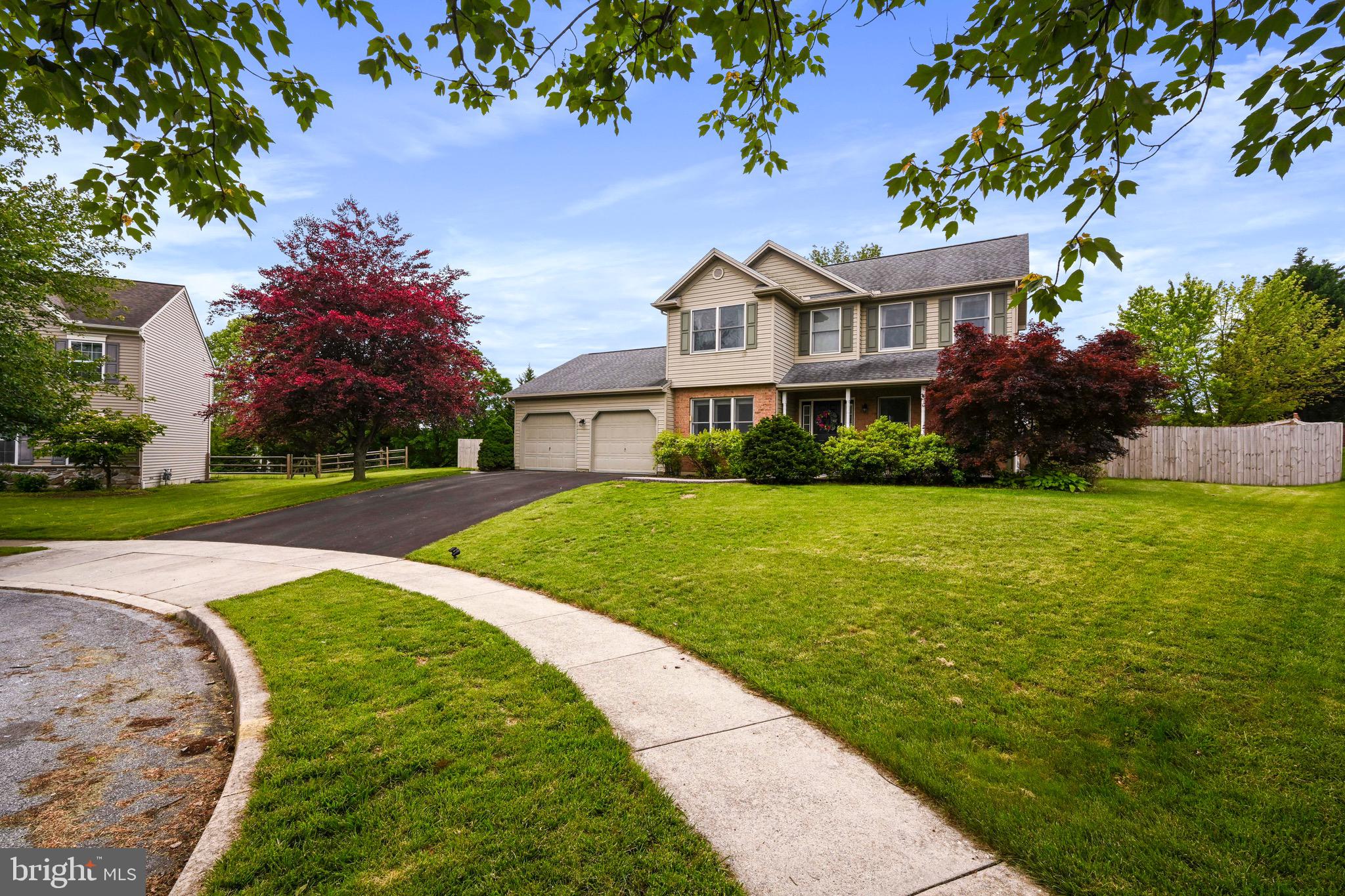 329 Hunter Path Road Hummelstown, PA 17036 - Photo 32 of 37 a front view of a house with garden