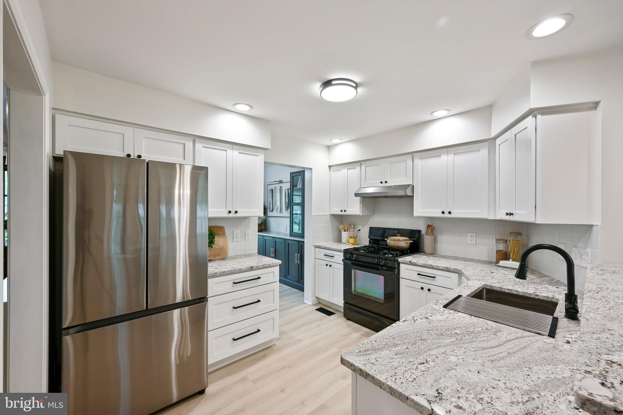 329 Hunter Path Road Hummelstown, PA 17036 - Photo 7 of 37 a kitchen with stainless steel appliances granite countertop a refrigerator sink and stove