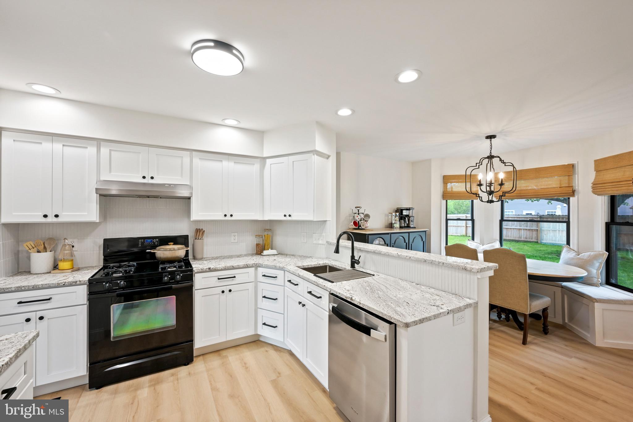 329 Hunter Path Road Hummelstown, PA 17036 - Photo 9 of 37 a kitchen with a sink stove and cabinets