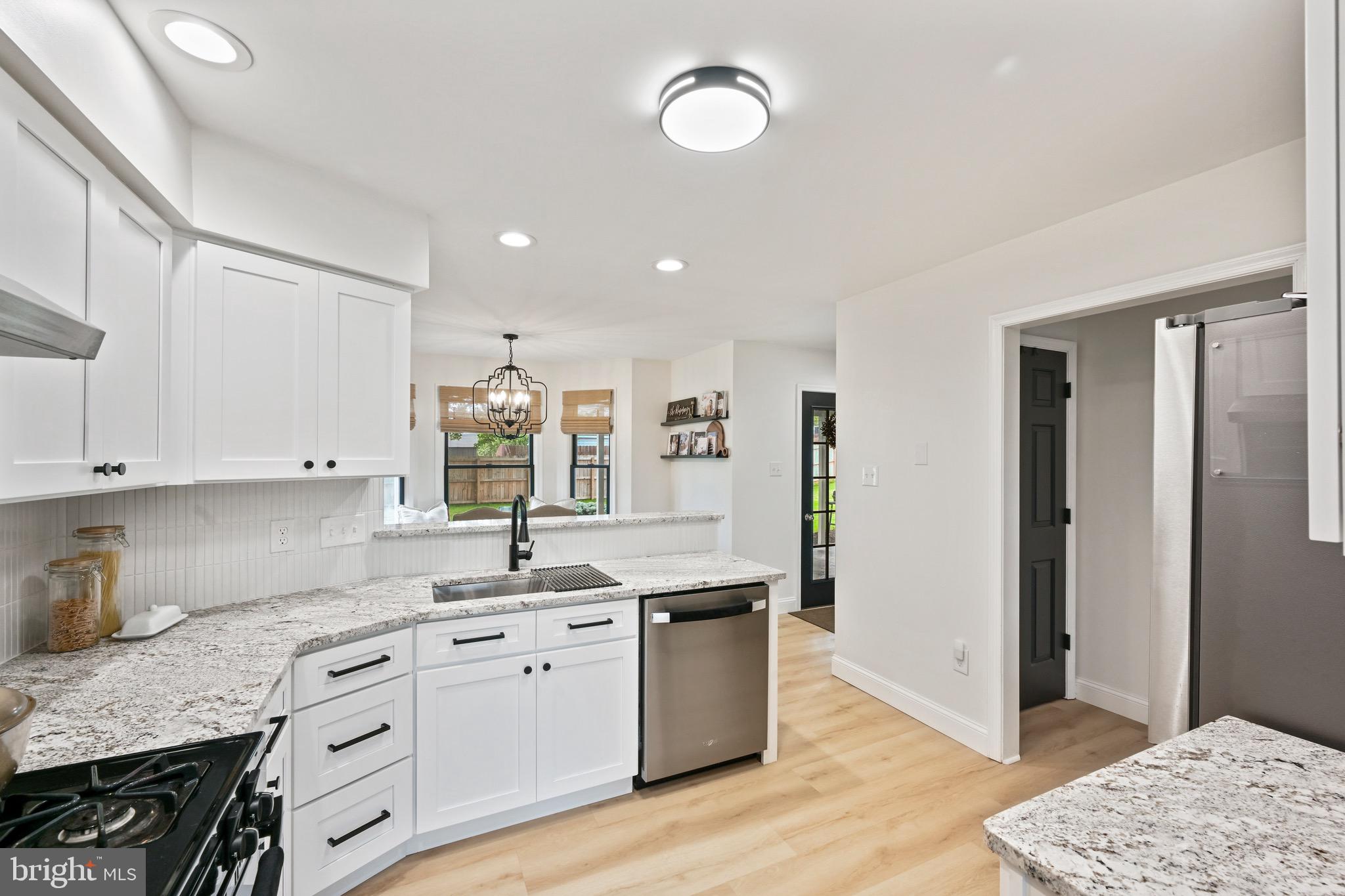329 Hunter Path Road Hummelstown, PA 17036 - Photo 10 of 37 a kitchen with granite countertop white cabinets and white appliances