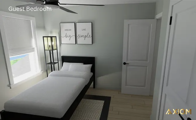 a bedroom with a bed and a television