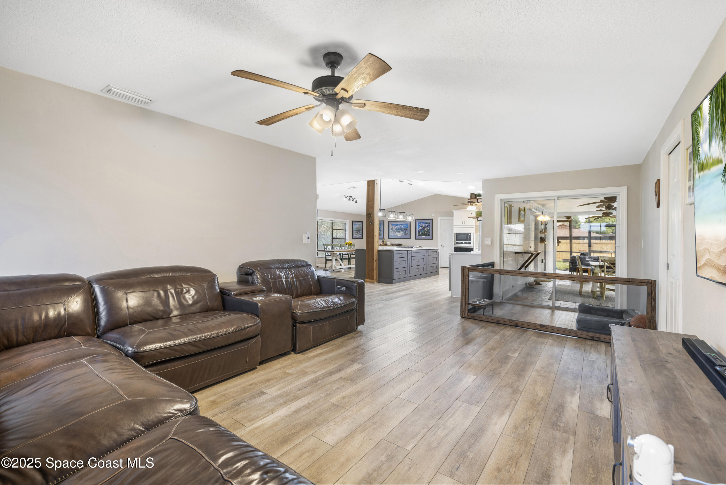 456 Narragansett Street Northeast Palm Bay, FL 32907 - Photo 19 of 43 a living room with furniture and a large window