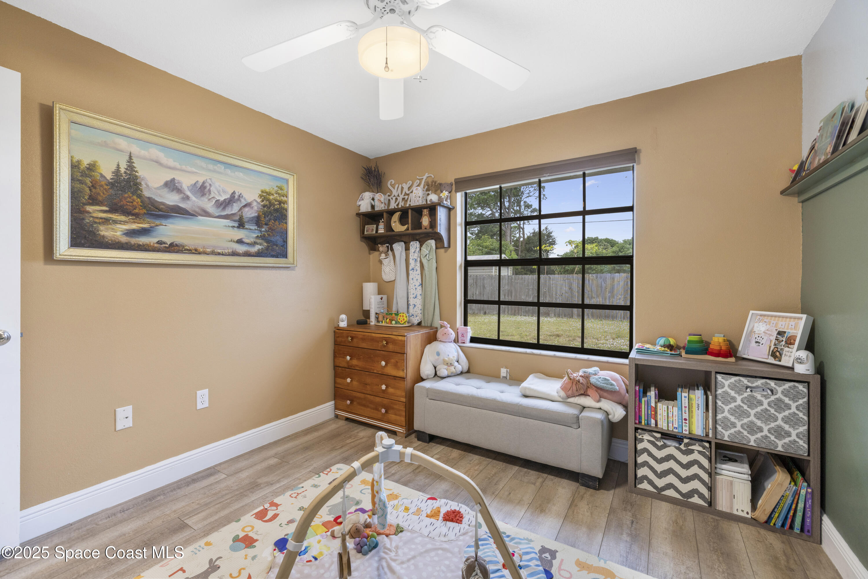 456 Narragansett Street Northeast Palm Bay, FL 32907 - Photo 33 of 43 a bedroom with furniture and a large window
