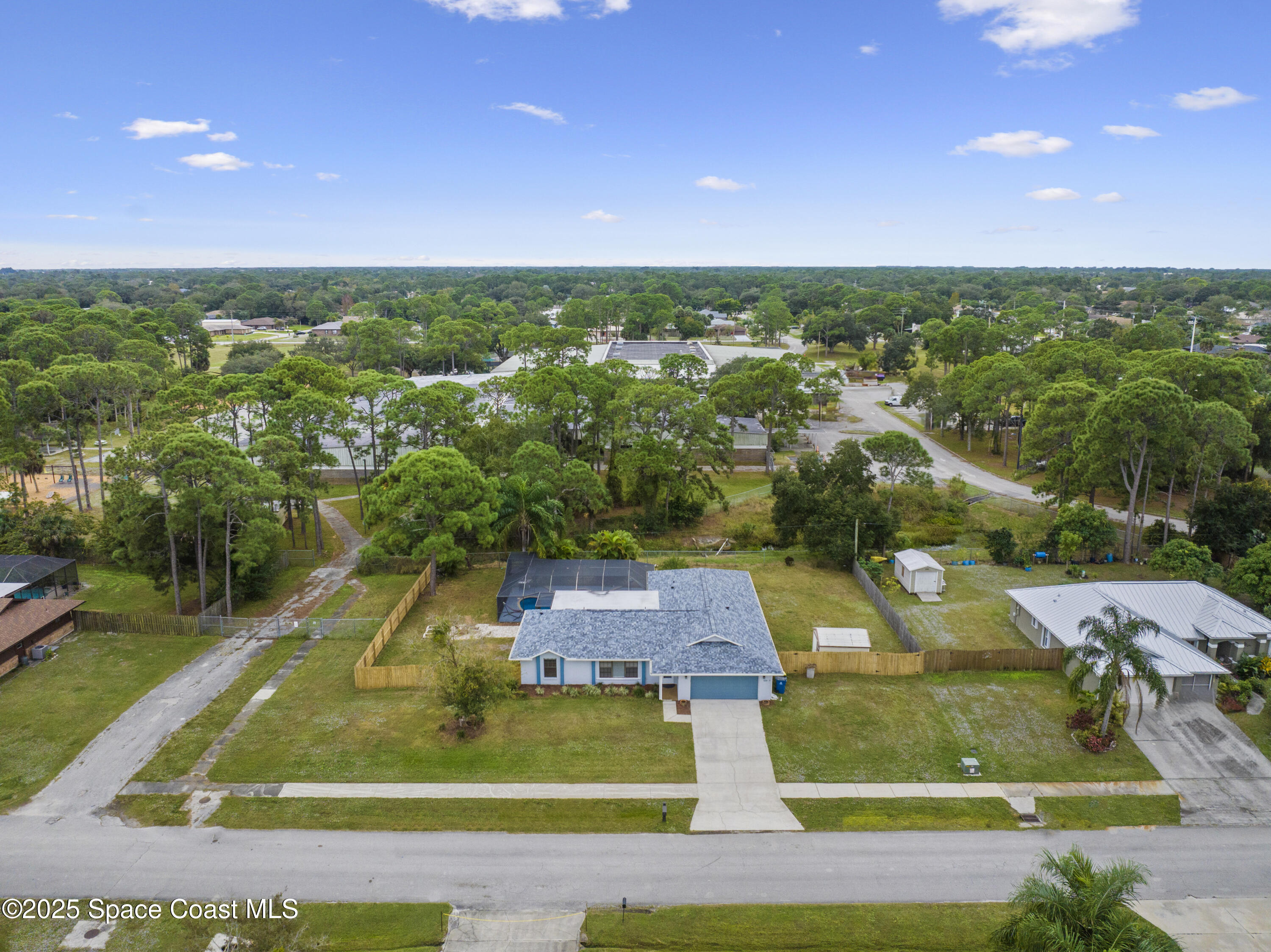 456 Narragansett Street Northeast Palm Bay, FL 32907 - Photo 42 of 43 an aerial view of residential houses with outdoor space and street view