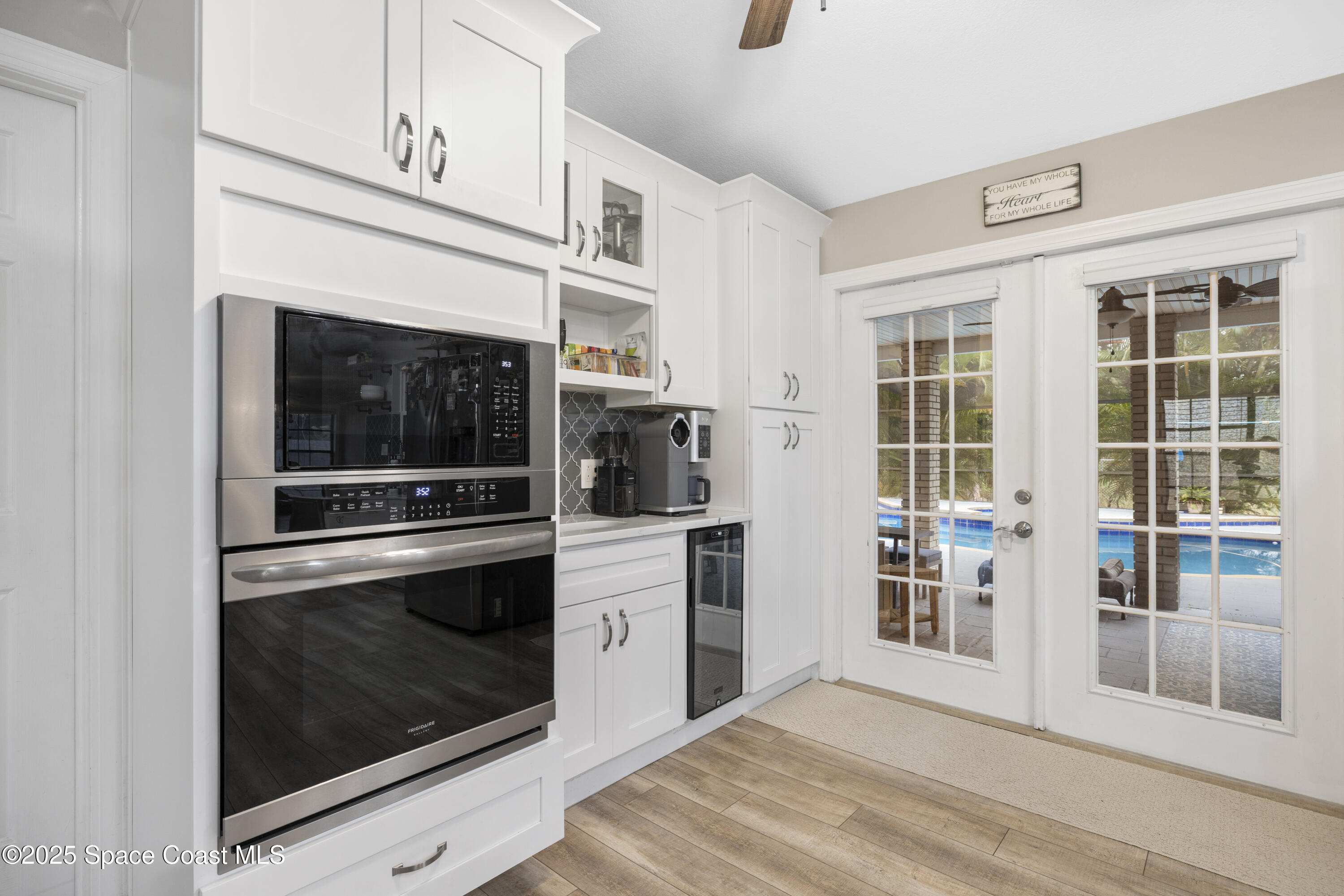 456 Narragansett Street Northeast Palm Bay, FL 32907 - Photo 7 of 43 a kitchen with a stove and cabinets