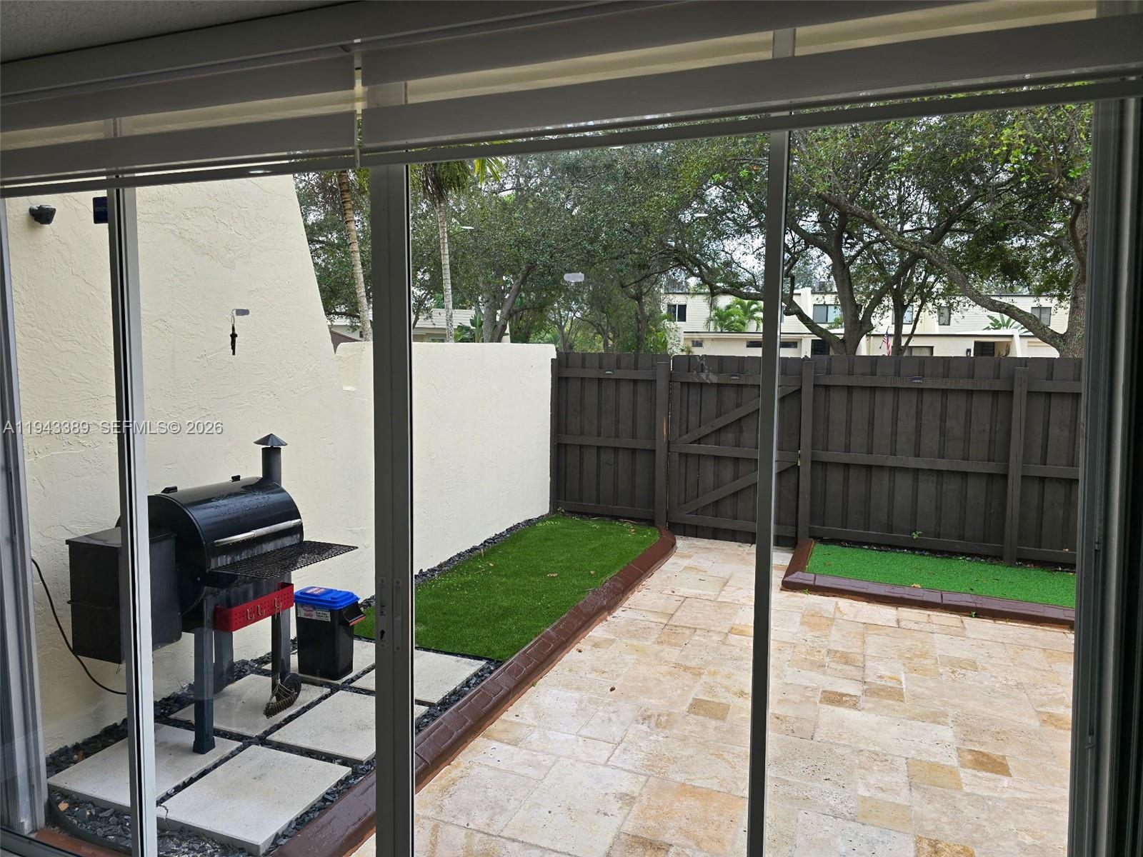 7753 Southwest 102nd Place Miami, FL 33173 - Photo 14 of 18 a view of a porch with seating space
