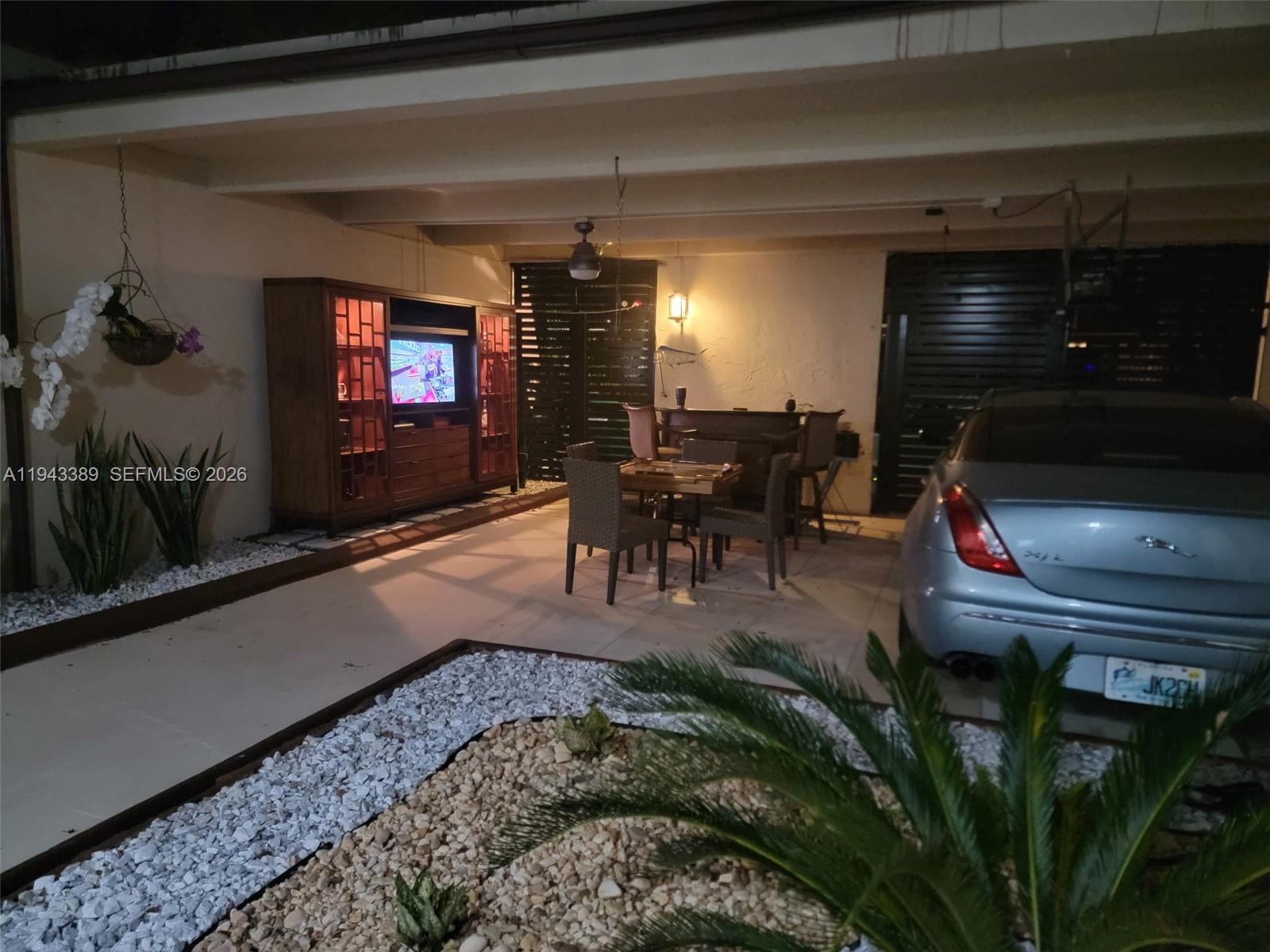 7753 Southwest 102nd Place Miami, FL 33173 - Photo 15 of 18 a living room with furniture and a flat screen tv