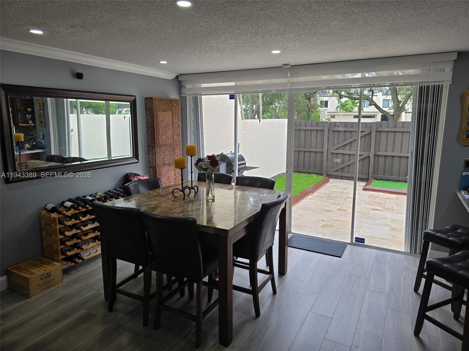 7753 Southwest 102nd Place Miami, FL 33173 - Photo 4 of 18 a view of a dining room with furniture window and outside view