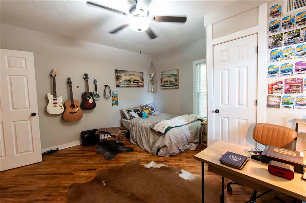 702 Radford Street Monroe, GA 30655 - Photo 17 of 49 a bedroom with furniture and a bed