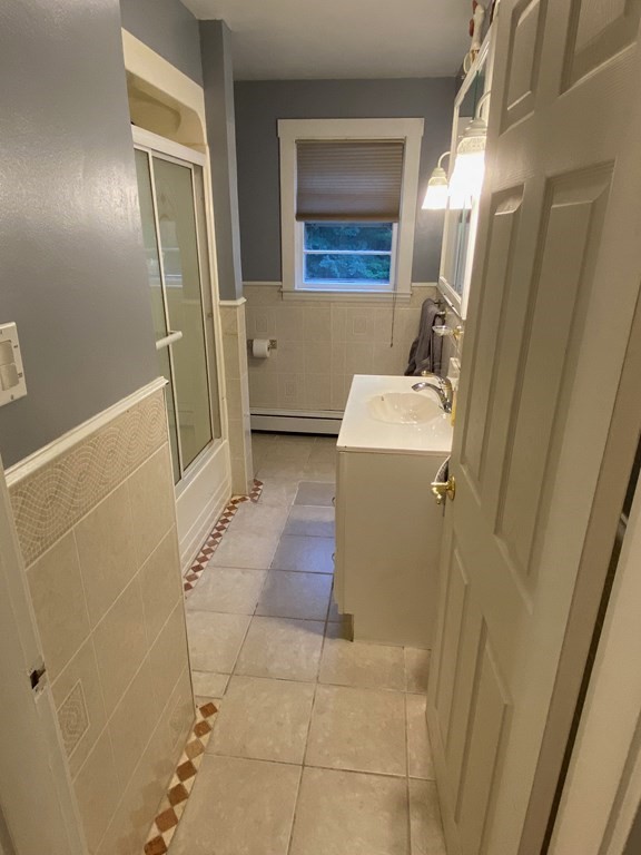 16 Worcester Road Townsend, MA 01469 - Photo 11 of 31 a bathroom with a sink a toilet and shower